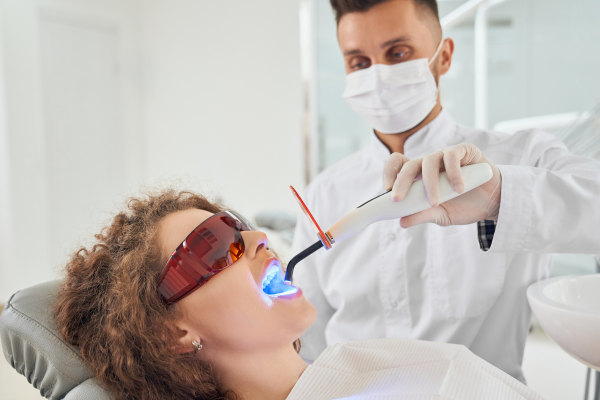 Patient receiving KTP laser teeth whitening treatment for coffee stains at a Sydney CBD dental clinic